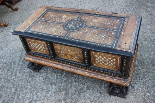 An antique Anglo Indian bone and brass inlaid chest with triple panel front carved tortoise