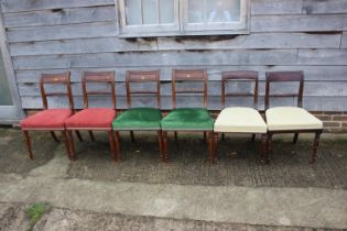 A Harlequin set of six rope twist bar back dining chairs with stuffed over seats, on turned supports