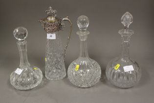 A silver plate mounted and cut glass claret jug with lion finial, 12 1/2" high, and three clear