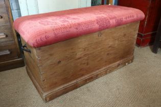 A waxed pine blanket box/ottoman with padded top, 38" wide x 18" deep x 20" high