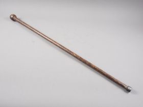 A palm wood walking stick, 35" long