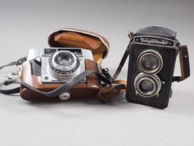 A Voigtlander "Brilliant" camera and an Agfa camera, in travelling case