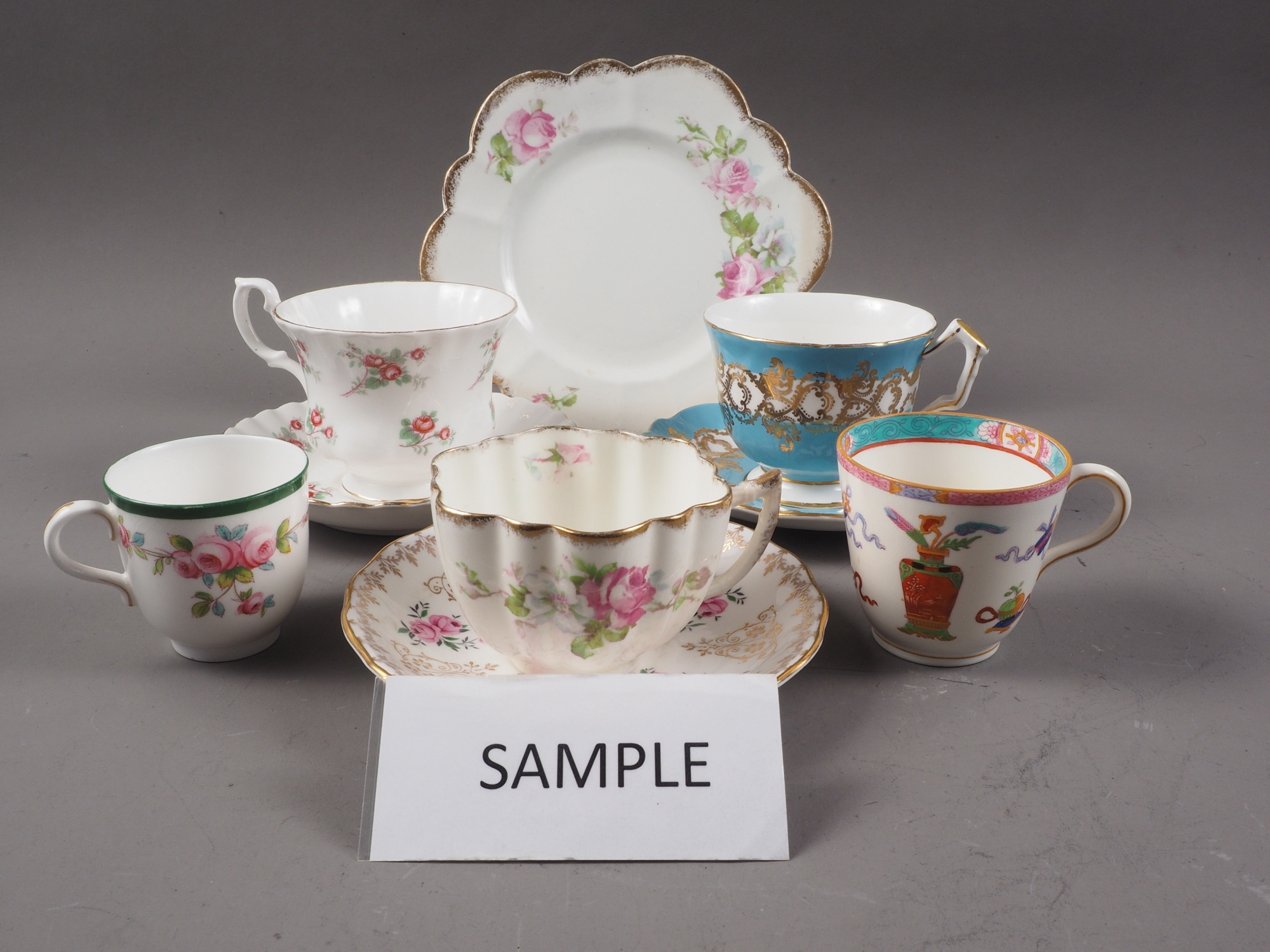 An Aynsley 1215 pattern teacup and saucer, a pair of Royal Worcester coffee cups, various Royal