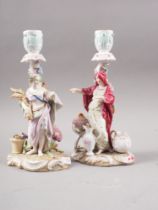 Two 19th century German candlesticks, harvester and merchant, 8 3/4" high (damages)