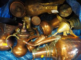 A graduated set of four copper and brass Dallah coffee pots, three other similar coffee pots and