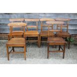 A Harlequin set of six 19th century oak bar back dining chairs with panel seats and stretchered