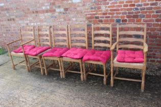 A set of six beech ladderback chairs with rush envelope seats, on turned and stretchered