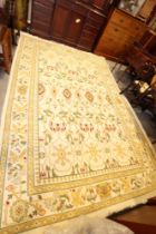 An Indian flat weave/crewelwork carpet with all over geometric design on a cream ground and bird and