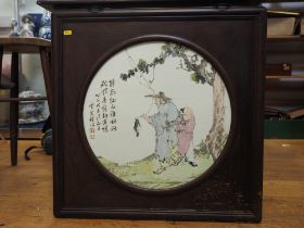A Chinese porcelain circular panel, decorated two fishermen and script, 17" dia, in rosewood frame