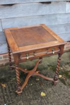 An oak square top desk, fitted one drawer, on barley twist supports, united by an 'X' stretcher, 24"