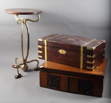 An Egyptian style brass and hardwood circular topped occasional table, on shaped splay supports