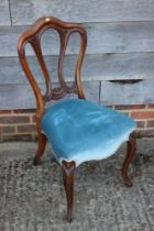 A 19th century carved mahogany shape back side chair and a child's deportment/high chair
