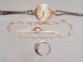A yellow metal, ruby and diamond bracelet, stamped 10K, 6.8g, a lady's 9ct gold cased wristwatch,