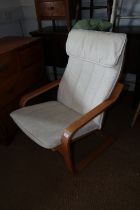 A "Poang" beech framed cantilever armchair, upholstered in an off-white linen fabric