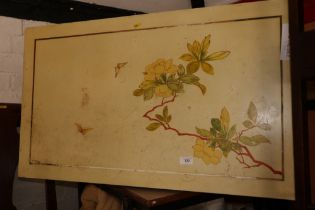 A yellow flower decorated coffee table, on square taper supports