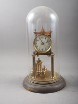 A 400-day clock, under a glass dome shade, 13" high, and a 19th century jewellery box, 14" wide (