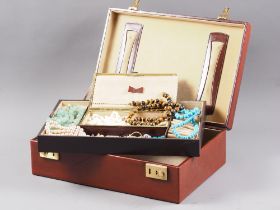 A brown leather jewellery box, containing a selection of silver, costume and other jewellery