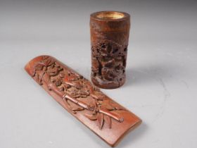 A Chinese bamboo wrist rest with carved bamboo decoration, 9 1/2" long x 2 3/4" wide, and a