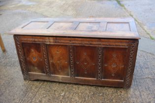 An 18th century chip carved oak triple panel coffer, with candle box, 57" wide x 24 1/2" deep x
