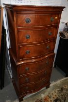 A figured mahogany serpentine front tallboy, fitted six drawers, on bracket feet, 21" wide x 16"