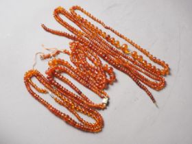 A collection of various facetted amber coloured bead necklaces, 288.7g gross