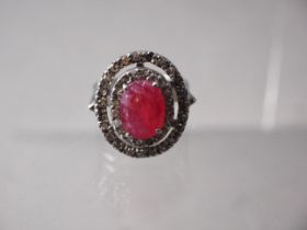 A white metal, stamped 925, Ruby and diamond dress ring, the centre stone 4.7ct approx