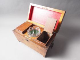 An early Victorian burr yew tea caddy with ring handles, the interior fitted with two compartments