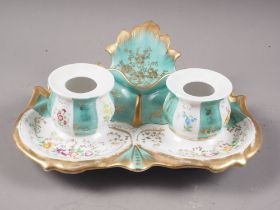 A late 19th century French porcelain desk inkstand with two wells and floral and gilt decoration,
