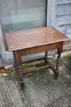 An oak side table of 17th century design, on barley twist stretchered supports, 30" wide x 20"