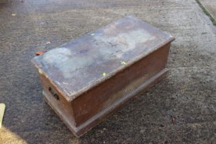 A brown painted pine blanket box with wrought iron carry handles, 36" wide x 18" deep x 15" high,