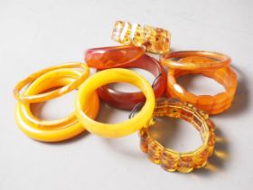 A collection of amber Bakelite bangles and bracelets, 280.4g gross