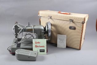 A Jones Popular straight stitch sewing machine, serial number 2E 006658, in carry case