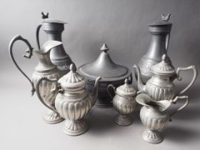 A pair of tappet hens, 14" high, a pewter five-piece tea and coffee set, and a pewter bowl and cover
