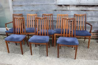 A set of eight G Plan "Danish Fresco" teak dining chairs with blue velvet seats, on tapering