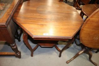 A 1920s walnut octagonal two-tier occasional table, on cabriole supports, 30" dia x 28" high