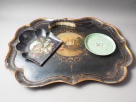 A 19th century papier-mache tray with floral centre, 30" wide, a papier-mache crumb scoop and