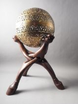 An antique pierced and engraved brass spherical incense holder, 12 1/2" dia, on later hardwood stand