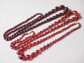 Three various cherry amber Bakelite facetted bead necklaces, 241.5g gross