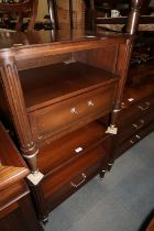 A pair of mahogany and brass mounted bedside cabinets, fitted recess over one door, on turned and