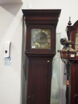 An 18th century oak long case clock with thirty-hour single handle movement and 10" brass dial by