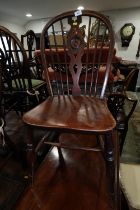 A 19th century Windsor target back dining chair, without panel seal, on turned and stretchered