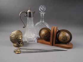 A pair of glass decanters and stoppers, two others, a pair of bookends, formed as globes, meat