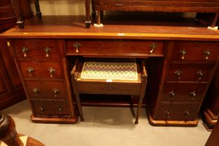 A late 19th century walnut double pedestal desk, fitted nine drawers, on block base, 58" wide x 21