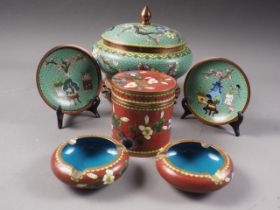 A Chinese cloisonne jar and cover, with bird and flowers decoration on a green ground, on associated