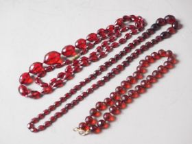 Three various cherry amber facetted bead necklaces, 120.7g gross