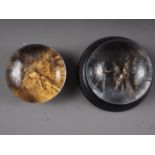 Two mid 19th century "pinchbeck" paperweights, "Sale of Joseph", on marble base, 4 1/2" dia, and "