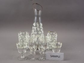 A late 20th century glass drinking set with grapevine decoration, thirty pieces approx, a Tuscan "
