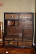 A late 19th century Japanese lacquer and inlaid cabinet, fitted sliding doors over recess, three