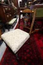 An Edwardian rosewood and inlaid low seat nursing chair, and a cane back occasional chair