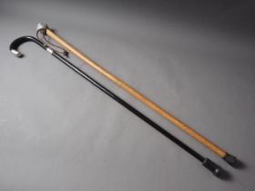 A Malacca walking cane with moonstone and other feldspars spherical knop and an ebonised walking